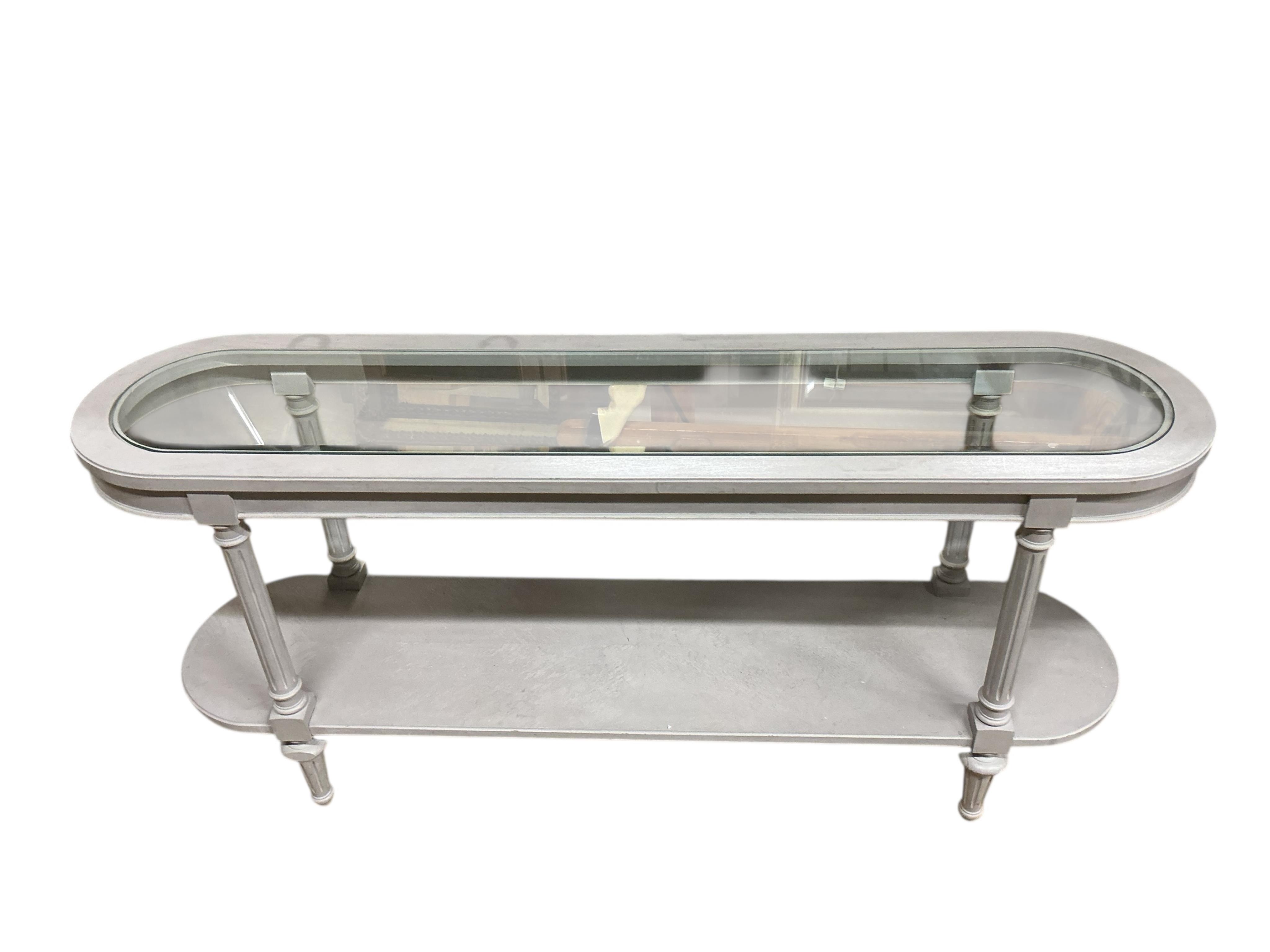 A painted two tier glass top console table, width 146cm, depth 35cm, height 67cm